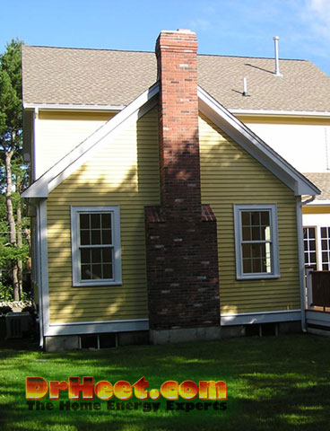 Home with chimney on exterior wall